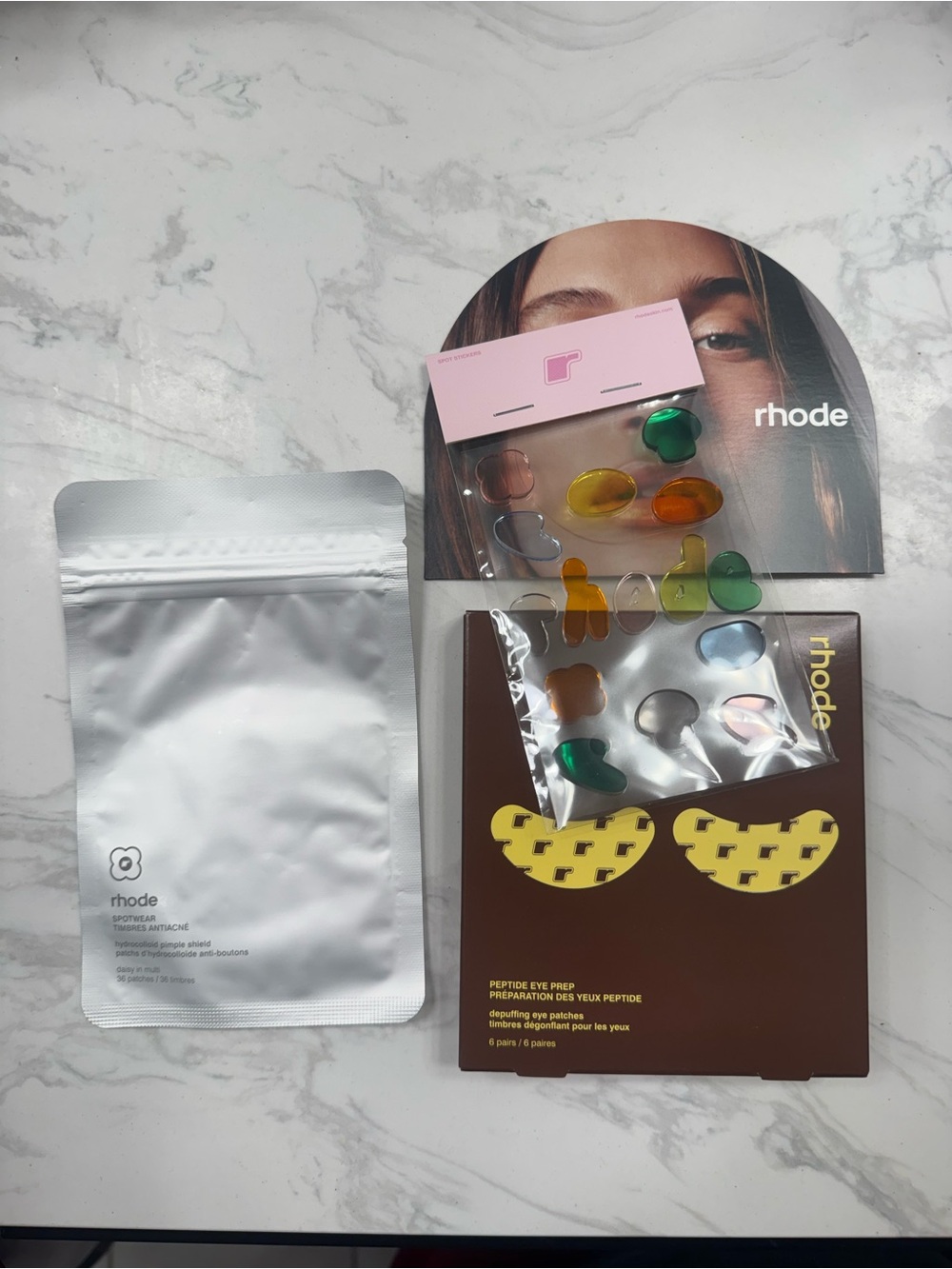 RHODE Gel Eye Patches with Yellow Crescent Accents and Green Capsules